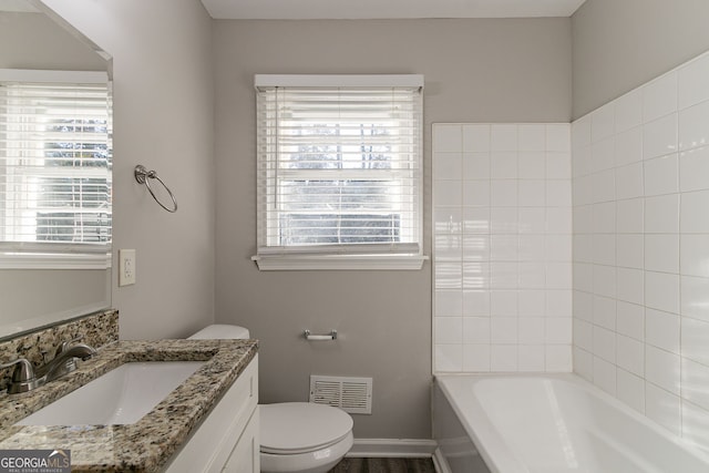 bathroom with vanity and toilet