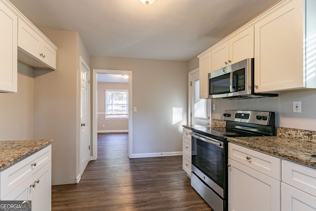 kitchen featuring white cabinetry, appliances with stainless steel finishes, and light stone counters