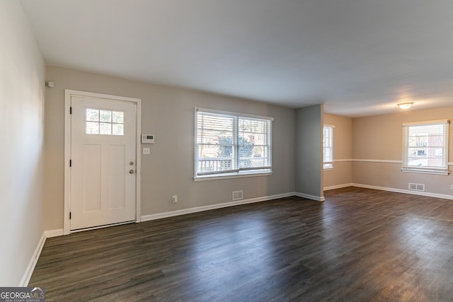 entrance foyer with dark hardwood / wood-style floors