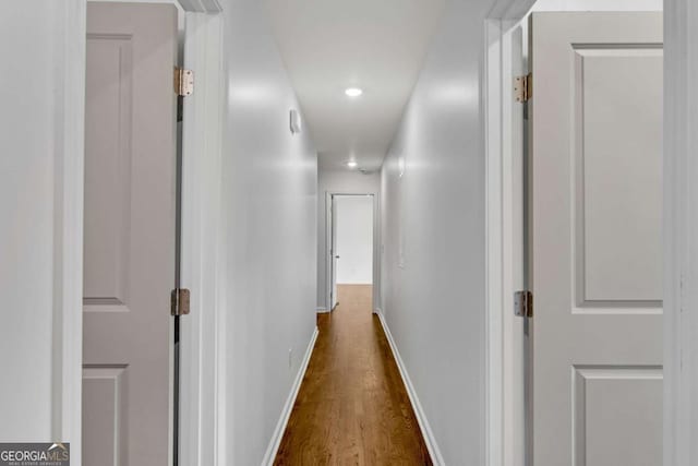 corridor featuring dark hardwood / wood-style floors