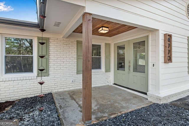 doorway to property featuring a patio