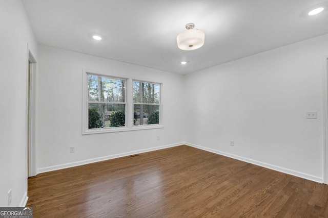 empty room featuring dark hardwood / wood-style floors