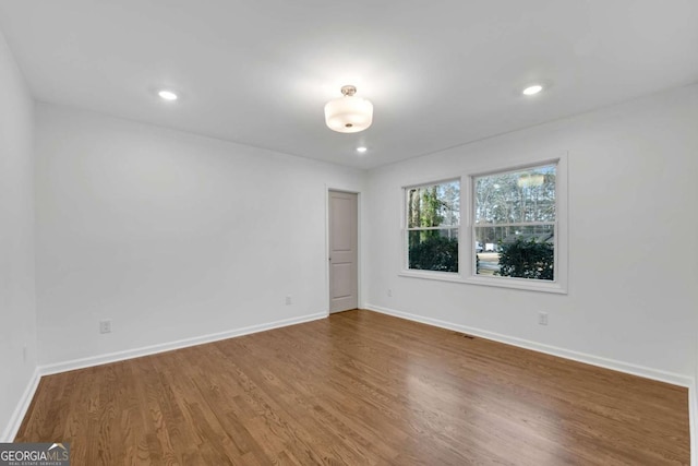 empty room featuring hardwood / wood-style flooring