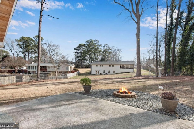 view of front of home featuring an outdoor fire pit and a patio