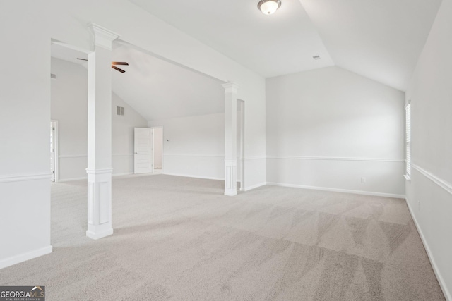 additional living space featuring ornate columns, carpet, baseboards, and vaulted ceiling