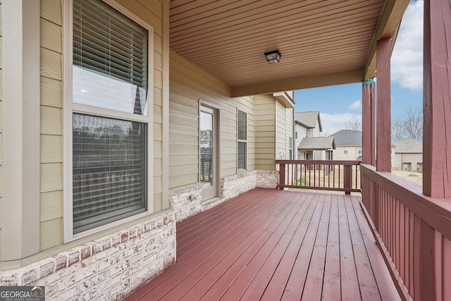 wooden terrace with a porch