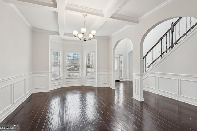 unfurnished dining area featuring a notable chandelier, dark wood-style flooring, coffered ceiling, stairway, and beam ceiling