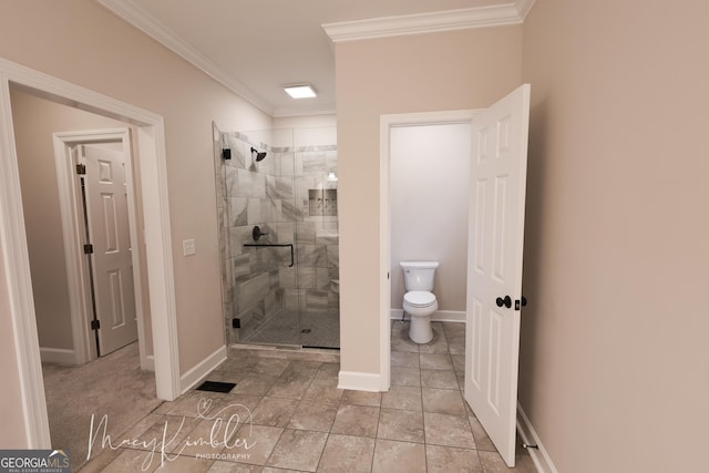 bathroom with a shower with door, ornamental molding, and toilet