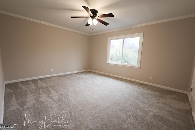 carpeted empty room featuring crown molding and ceiling fan