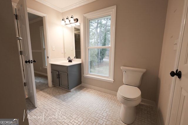 bathroom featuring crown molding, vanity, and toilet