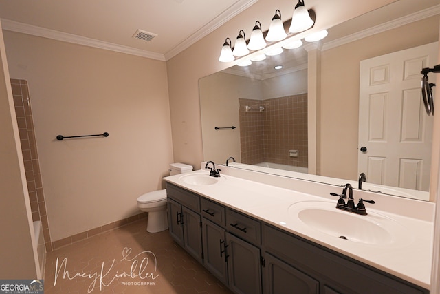 bathroom with crown molding, vanity, toilet, and tile patterned flooring