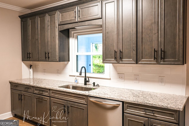 4804 Brittany Dr, Macon, GA 31210 - kitchen with dishwasher, dark brown cabinetry, ornamental molding, decorative backsplash, and light stone counters