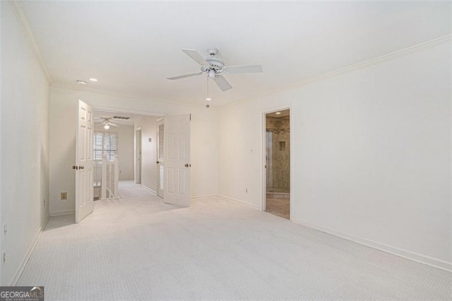 unfurnished room with ceiling fan, ornamental molding, and light carpet