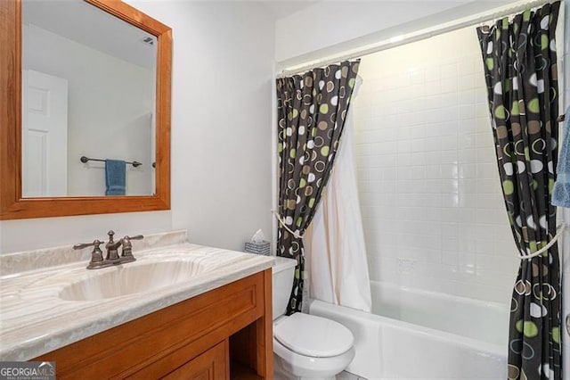 full bathroom with vanity, shower / bath combination with curtain, and toilet