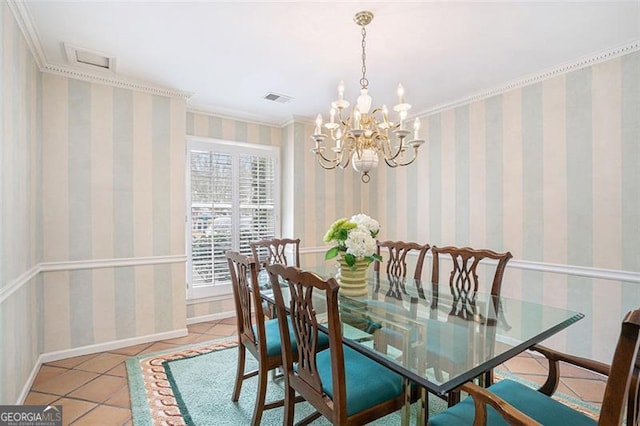 tiled dining room featuring a notable chandelier and ornamental molding