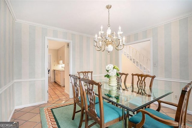 dining space with an inviting chandelier, ornamental molding, and light tile patterned flooring