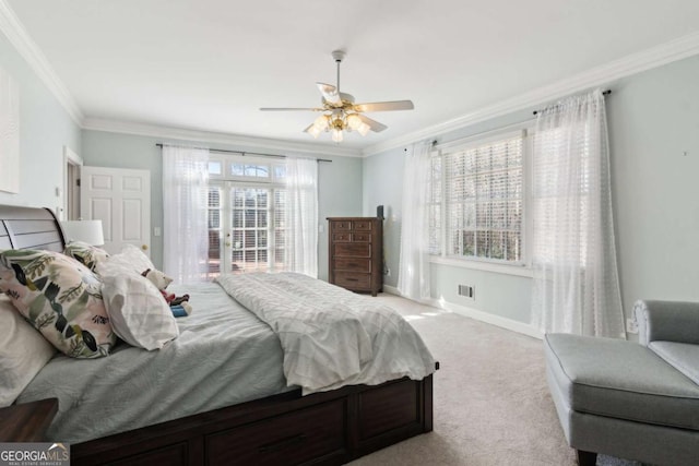 bedroom featuring ornamental molding, light colored carpet, and ceiling fan