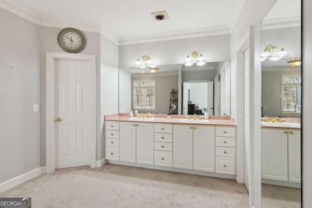 bathroom with vanity and crown molding