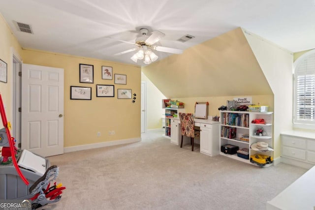 playroom with vaulted ceiling, light colored carpet, and ceiling fan