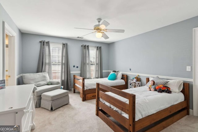 carpeted bedroom with ceiling fan