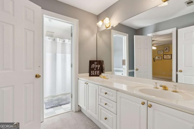 bathroom featuring vanity and ceiling fan