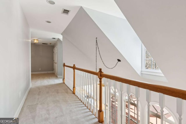 corridor with light colored carpet