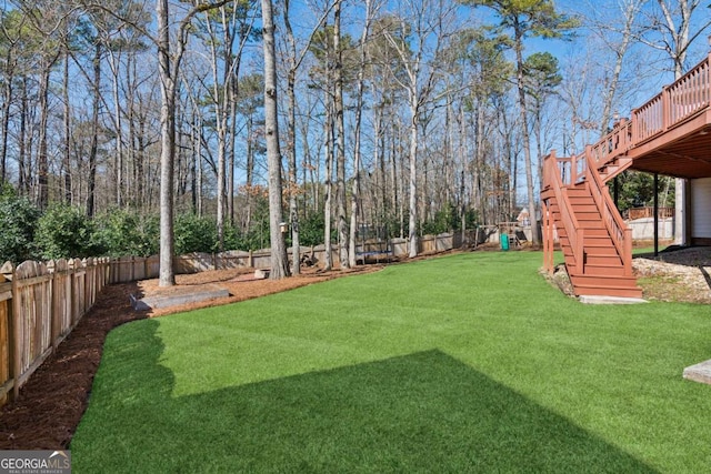 view of yard with a wooden deck