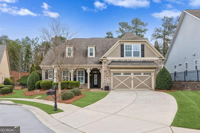 craftsman-style home featuring a garage and a front lawn