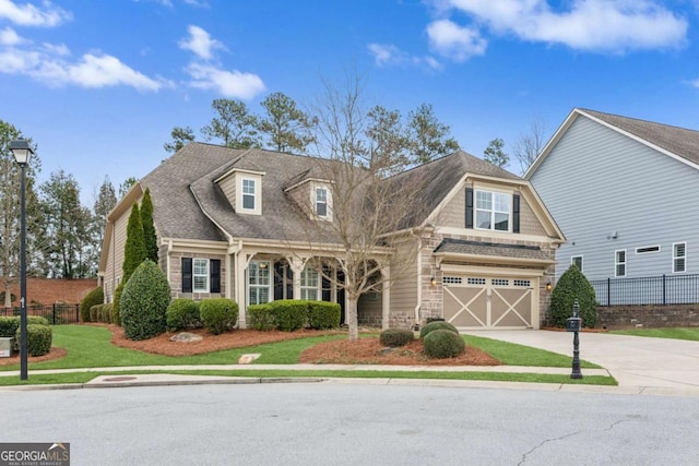 view of front facade with a garage and a front yard