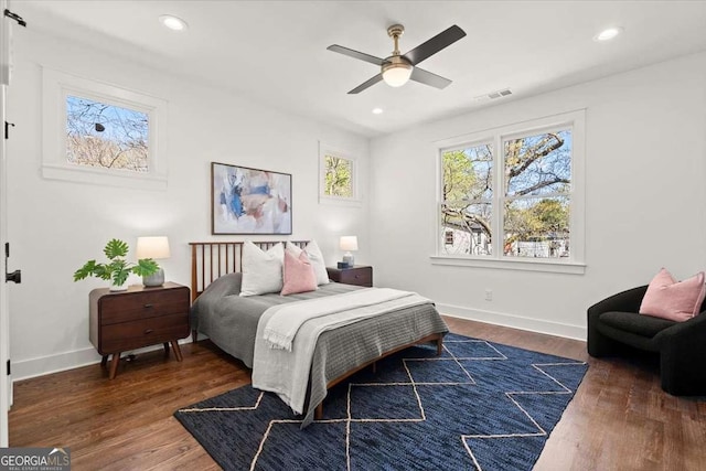 bedroom with recessed lighting, visible vents, and dark wood-style floors