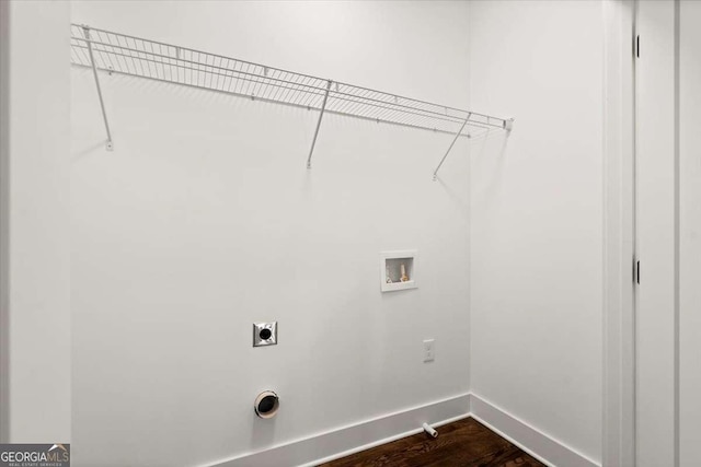 clothes washing area featuring baseboards, washer hookup, laundry area, hookup for an electric dryer, and dark wood-style flooring