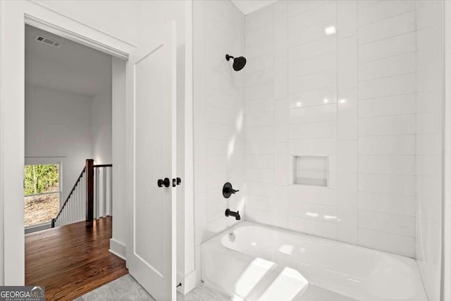 full bathroom featuring shower / bathing tub combination and visible vents
