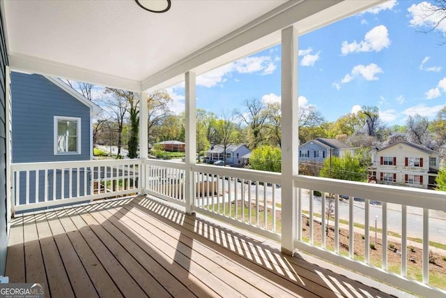 wooden terrace with a residential view
