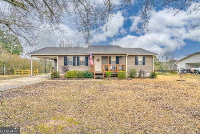 view of front of property with a carport and covered porch