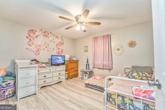 bedroom with ceiling fan and light wood-type flooring