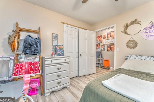 bedroom featuring light hardwood / wood-style floors and ceiling fan