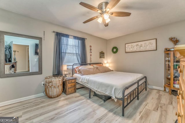 bedroom featuring ceiling fan and light wood-type flooring