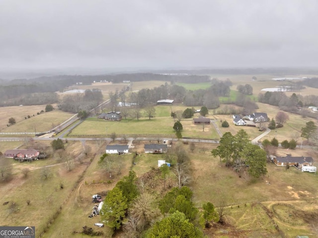 birds eye view of property featuring a rural view