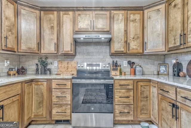 kitchen with light stone counters, ventilation hood, stainless steel electric range, and backsplash