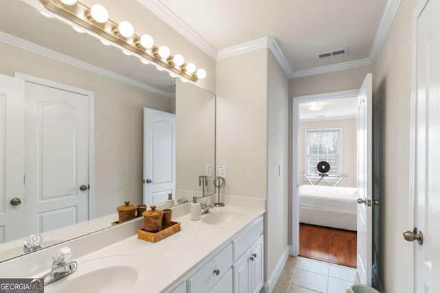 bathroom featuring ornamental molding, tile patterned floors, and vanity