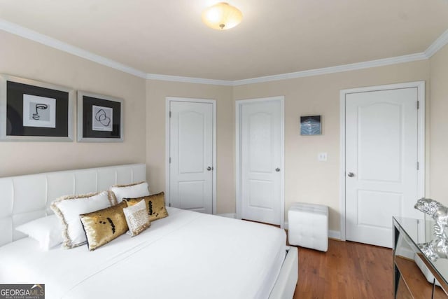 bedroom featuring ornamental molding and dark hardwood / wood-style floors