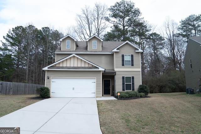 view of front facade with a garage, a front yard, and central air condition unit