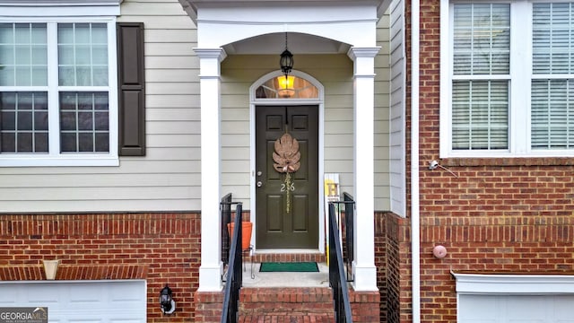 property entrance featuring a garage