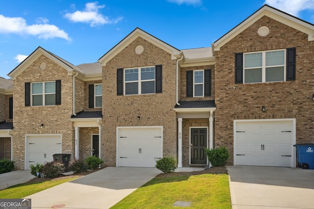 townhome / multi-family property featuring a garage