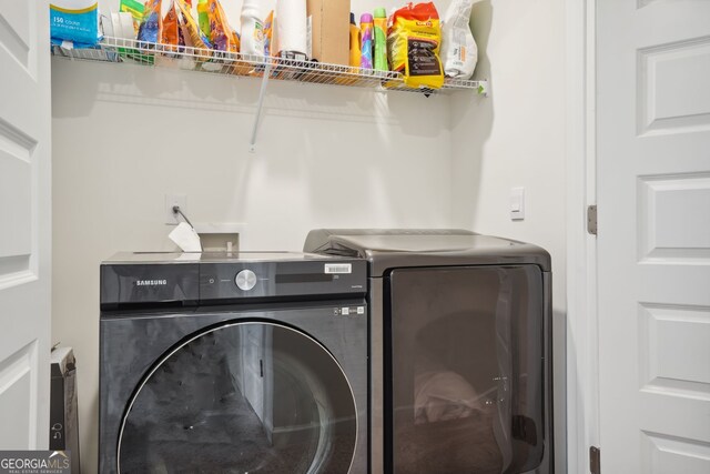 815 Taurus Dr, Stockbridge, GA 30281 - clothes washing area with separate washer and dryer