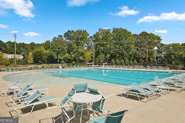 view of swimming pool with a patio area