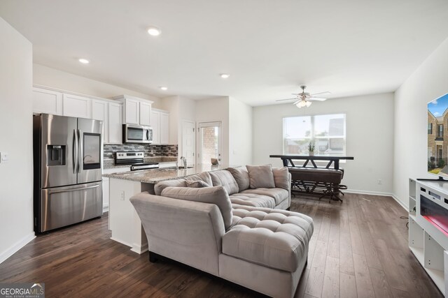 815 Taurus Dr, Stockbridge, GA 30281 - living room featuring dark hardwood / wood-style flooring and ceiling fan