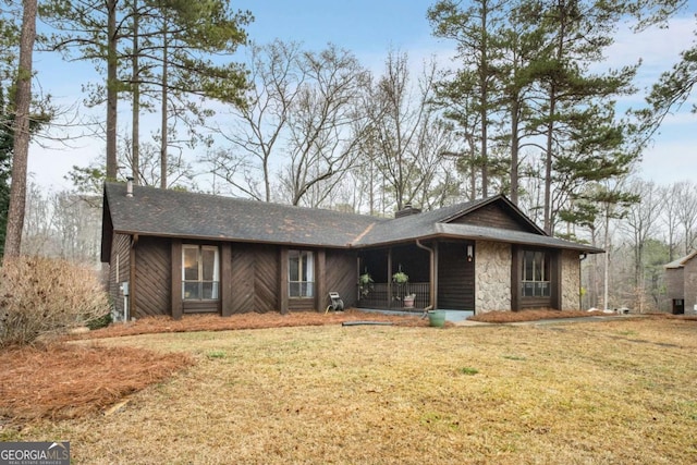 ranch-style house with a front lawn