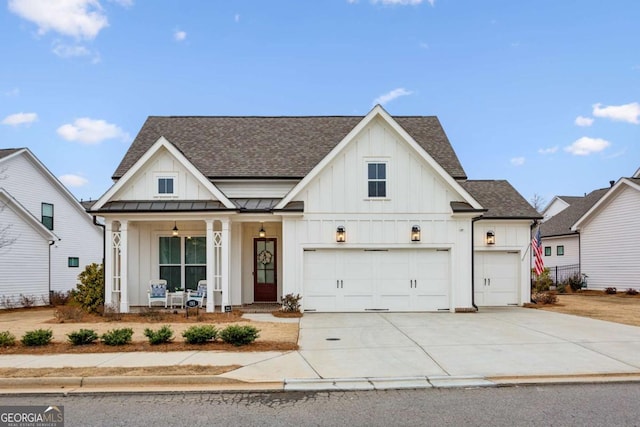 modern farmhouse style home with a porch and a garage