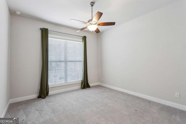 carpeted empty room with ceiling fan